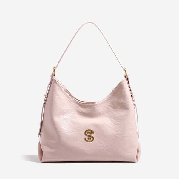 Crinkled leather-look hobo shoulder bag with gold-tone logo emblem and slim adjustable strap, detail view 6
