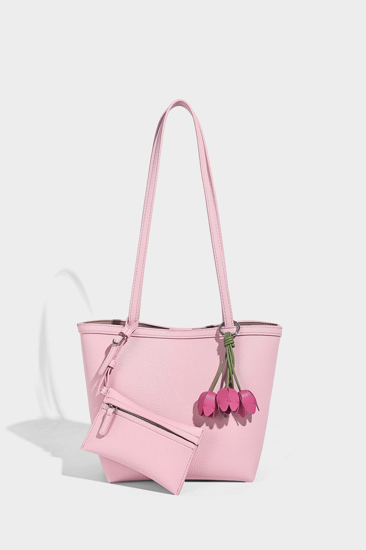 Structured pebbled leather-look tote bag in taupe with long shoulder strap, detachable zip pouch, and pink tulip flower