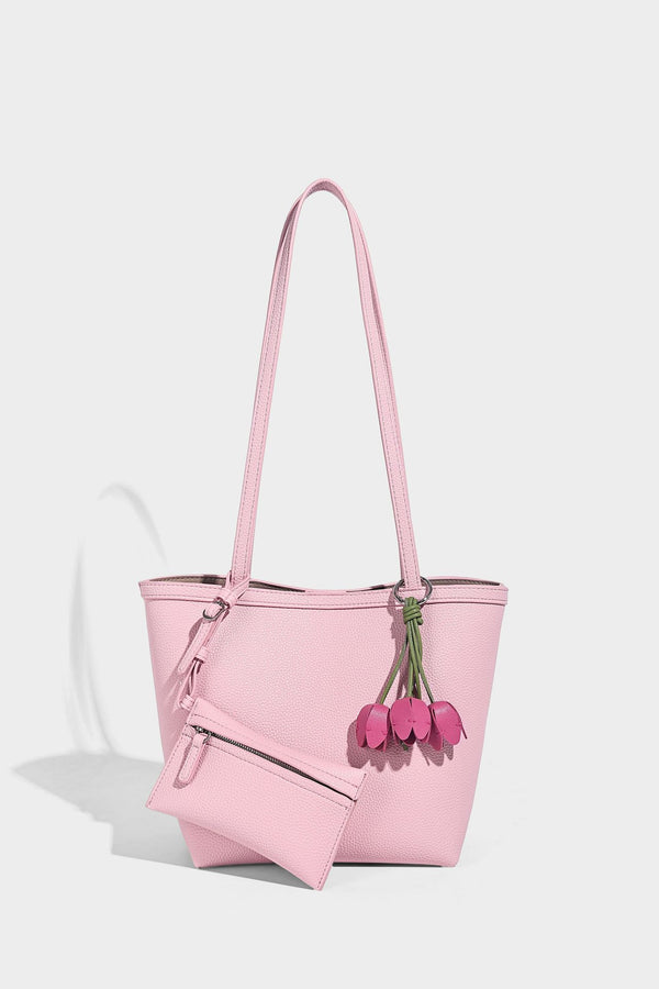 Structured pebbled leather-look tote bag in taupe with long shoulder strap, detachable zip pouch, and pink tulip flower