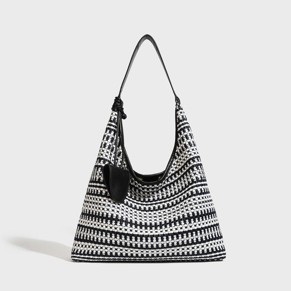 Slouchy woven stripe hobo shoulder bag with black-and-white pattern and leather-look strap, detail view 4