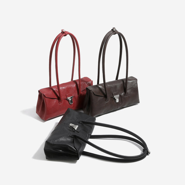 Compact structured rectangular flap shoulder bag with silver-tone turn-lock clasp and long rounded handles, detail view 2