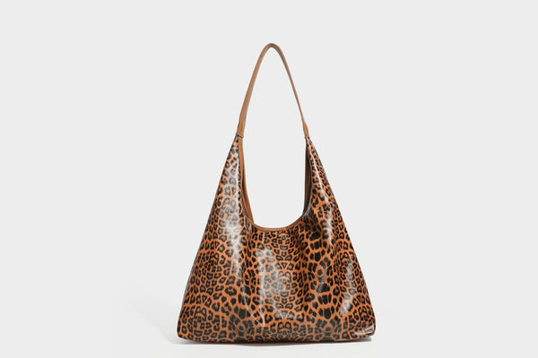 Glossy leopard-print slouchy shoulder bag with long strap and detachable tan zip pouch, detail view 26