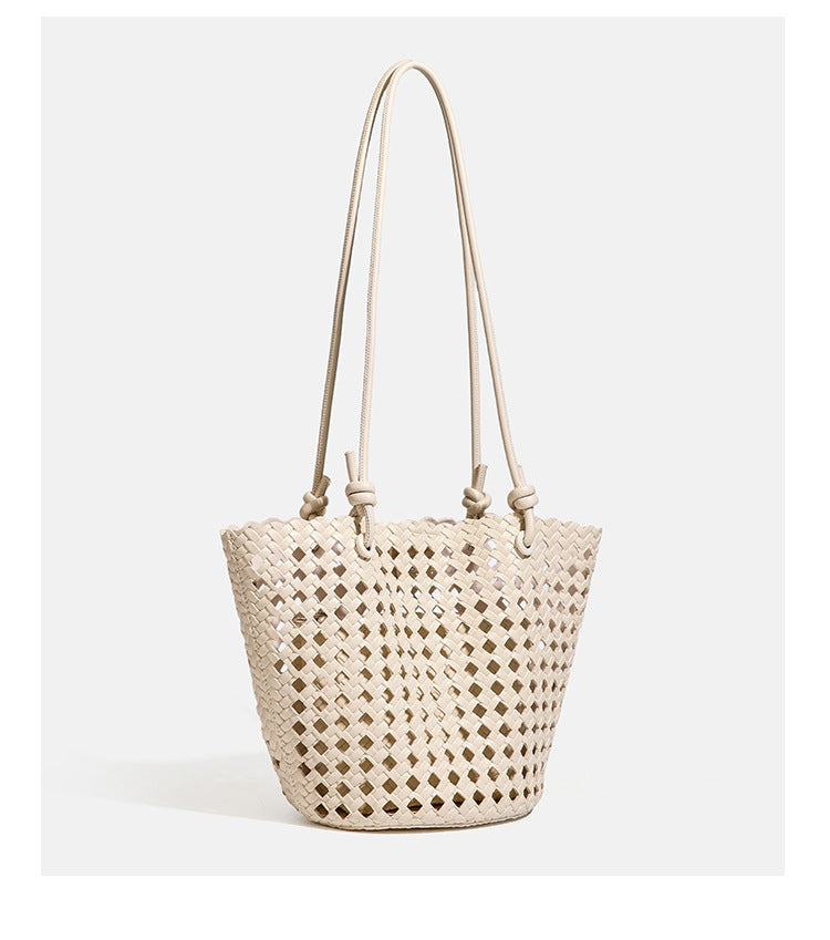Open-weave lattice bucket tote bag with long knotted cord handles and tapered silhouette, detail view 23