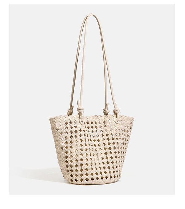 Open-weave lattice bucket tote bag with long knotted cord handles and tapered silhouette, detail view 23