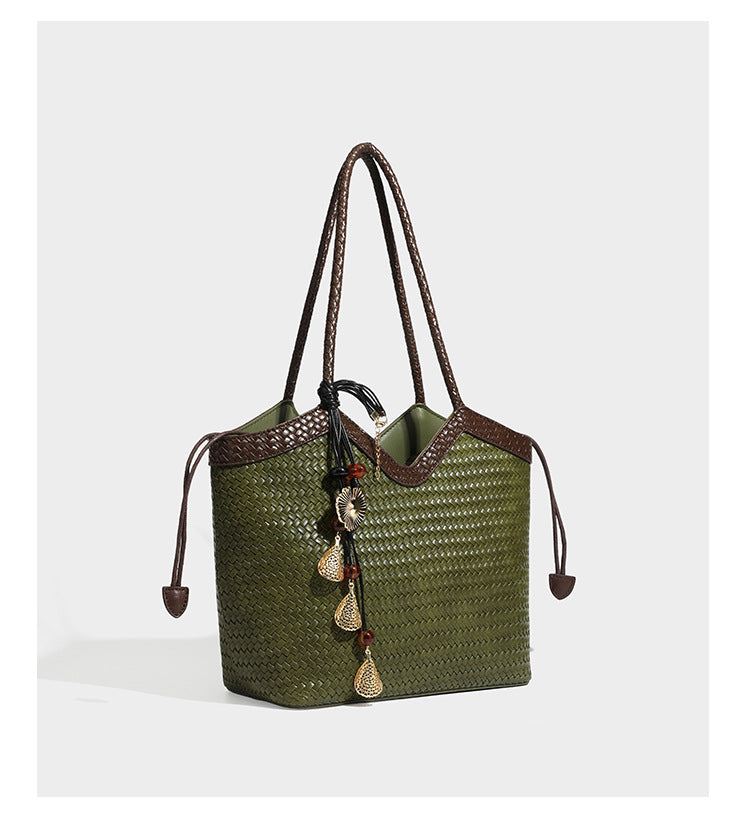 Woven tote bag with braided shoulder straps, drawstring closure, and dangling metal-and-bead charm, detail view 15