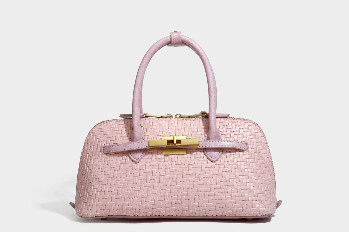 Structured woven-embossed leather-look satchel with dual rolled top handles, gold-tone turn-lock closure, and detachable