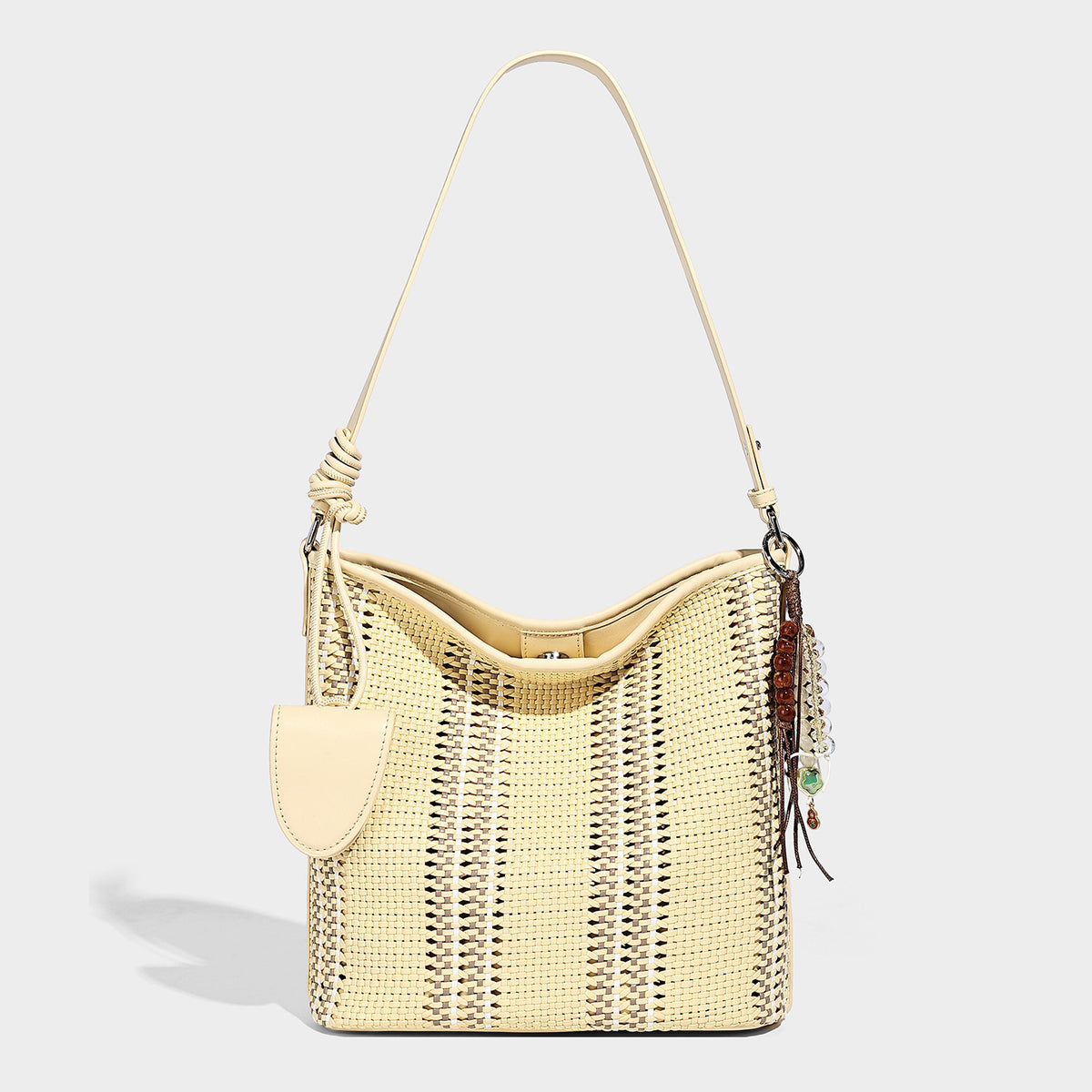 Woven bucket shoulder bag with leather-look trim, silver-tone hardware, and beaded tassel charm, detail view 9
