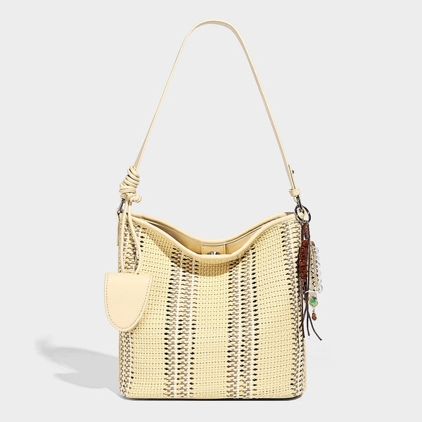 Woven bucket shoulder bag with leather-look trim, silver-tone hardware, and beaded tassel charm, detail view 9