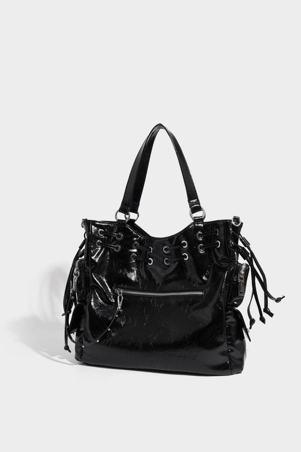 Glossy crinkled leather-look tote bag with silver grommet lace-up front detail, dual top handles, and detachable shoulder