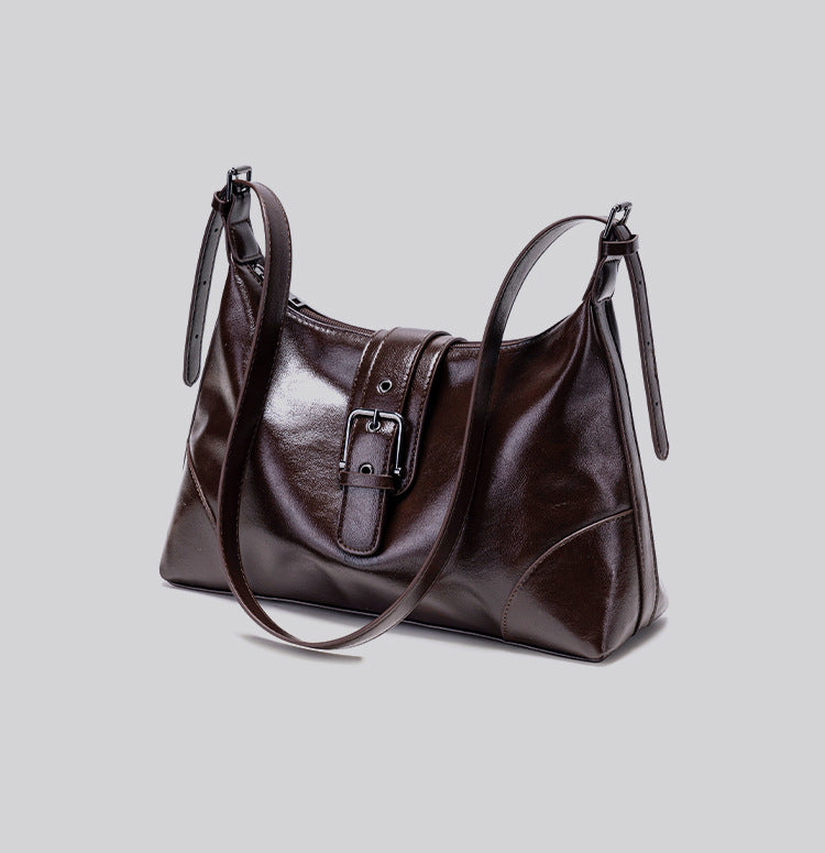 Glossy dark brown slouch hobo shoulder bag with front buckle strap panel and long adjustable single strap, detail view 13
