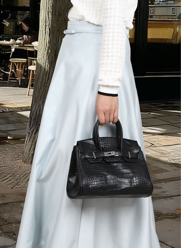 Croc-embossed structured trapezoid satchel with silver turn-lock hardware, rounded top handles, and detachable shoulder
