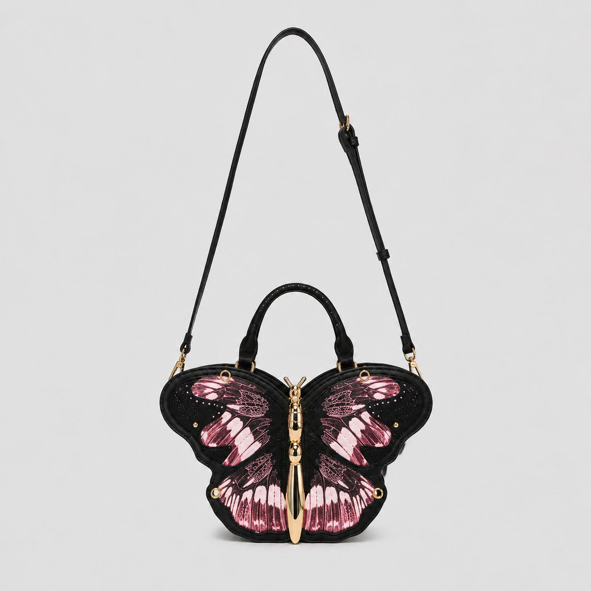 Schwarze Handtasche in Schmetterlingsform mit rosafarbenem Flügelprint und goldfarbenem, skulpturalem Schmetterlingskörper als Zipper, Detailansicht 13