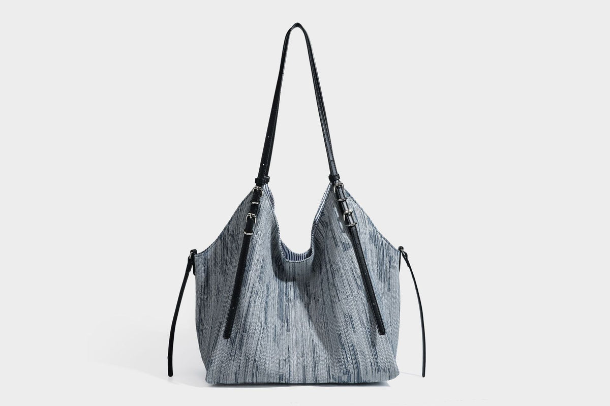 Large slouchy woven-texture shoulder tote bag with slim leather-look straps, side cinch ties, and silver-tone hardware