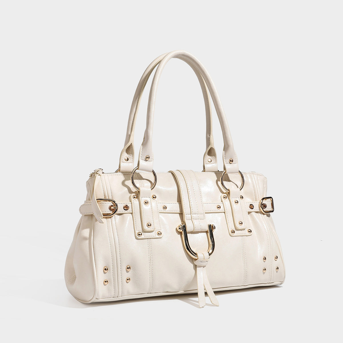 Dark brown glossy leather-look structured satchel tote with gold-tone studs, buckle straps, dual top handles, and detachable