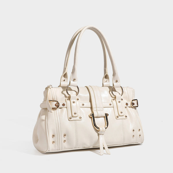 Dark brown glossy leather-look structured satchel tote with gold-tone studs, buckle straps, dual top handles, and detachable