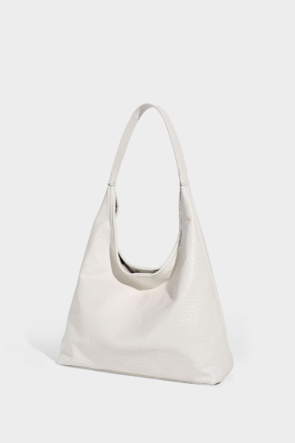 Slouchy hobo shoulder bag in pale yellow glossy pebbled leather-look finish with single shoulder strap and detachable front