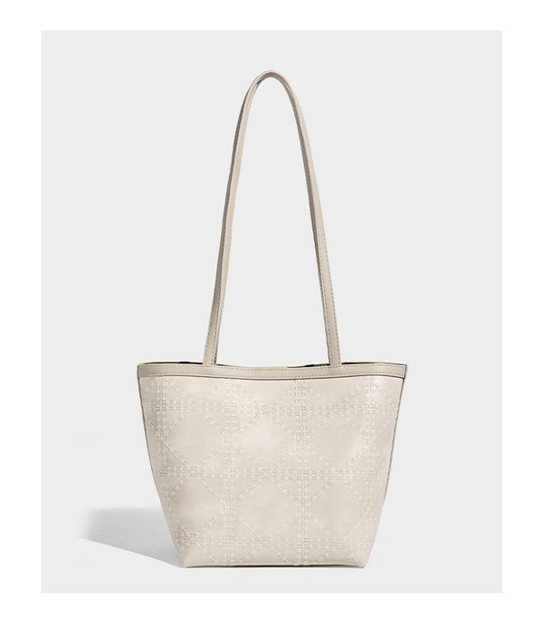 Quilted diamond-pattern tote bag with attached front zip pouch and long shoulder straps, detail view 10