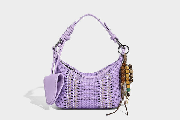 Small woven crescent shoulder bag with leather-look trim, zip closure, silver-tone ring hardware, and beaded tassel charm