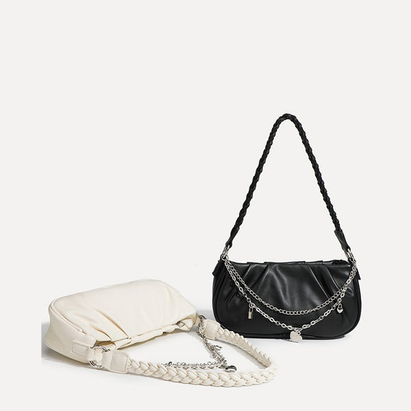 Slouchy hobo shoulder bag with gathered leather-look panels, silver-tone chain with charm pendants, and braided strap, detail