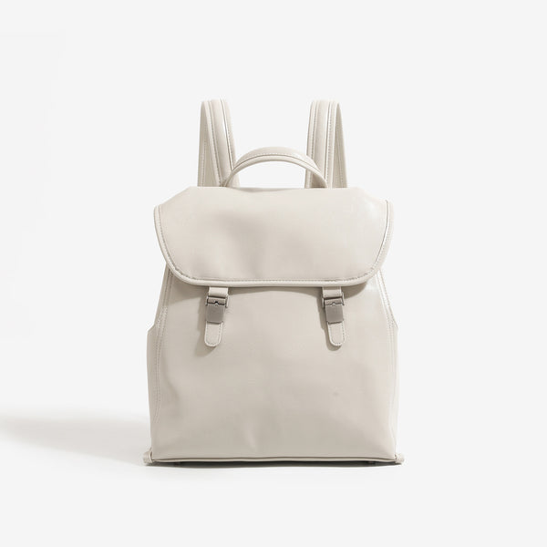 Structured glossy leather-look flap backpack handbag with dual buckle closures, top handle, and silver-tone hardware, detail