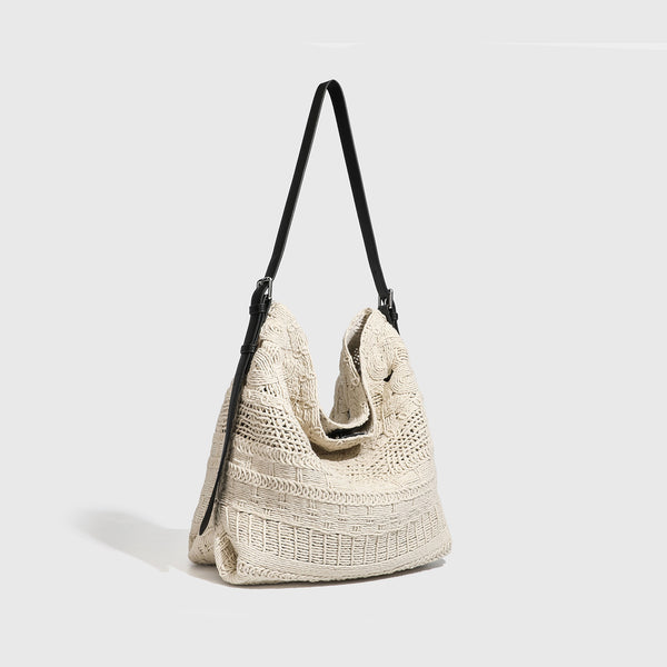 Cream woven rope-cord hobo bag with black adjustable leather-look strap and matching cream drawstring pouch, detail view 2