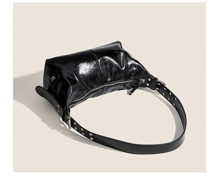 Glossy crinkled mini hobo shoulder bag with studded adjustable strap and silver-tone hardware, detail view 18