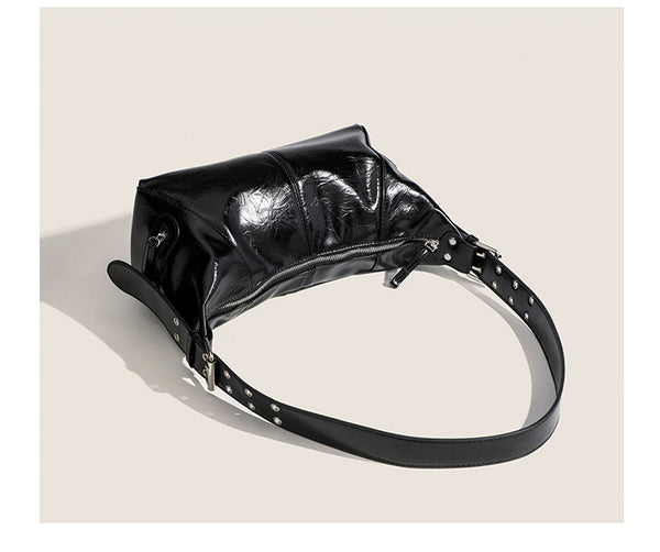 Glossy crinkled mini hobo shoulder bag with studded adjustable strap and silver-tone hardware, detail view 18