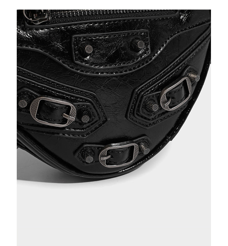 Mini heart-shaped crossbody bag with glossy crinkled finish and moto buckle hardware, detail view 14