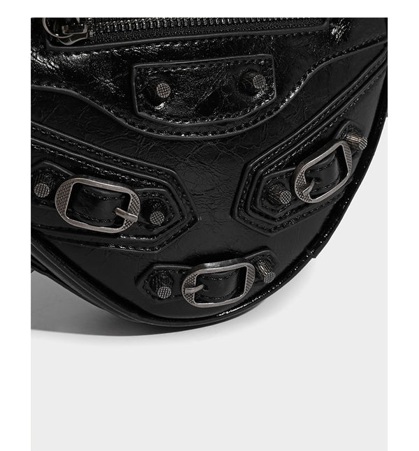 Mini heart-shaped crossbody bag with glossy crinkled finish and moto buckle hardware, detail view 14