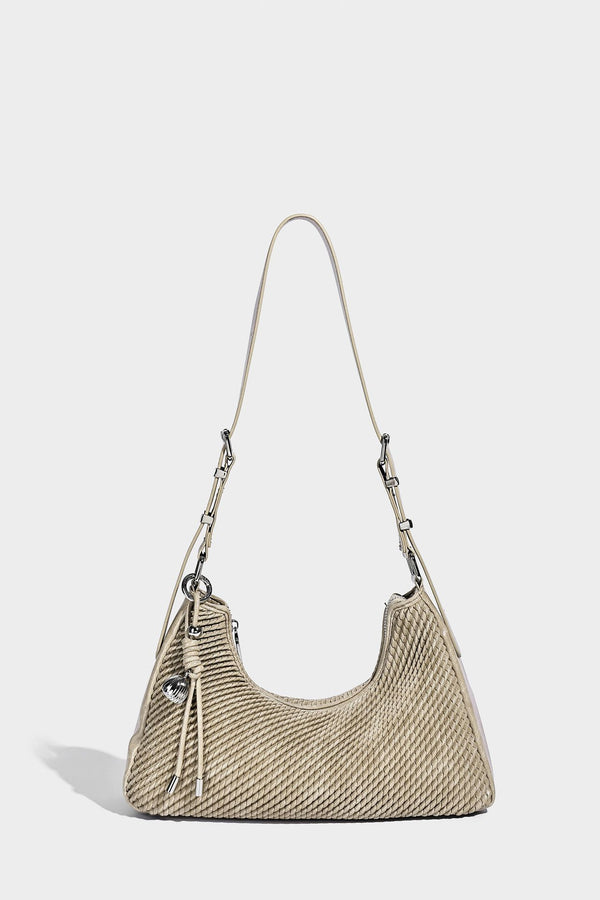 Woven crescent hobo shoulder bag with smooth side panels, zip-top closure, silver-tone charm hardware, and adjustable, detail