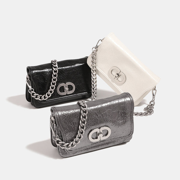 Rectangular flap shoulder bag with chunky silver-tone chain strap and crinkled leather-look finish, front view