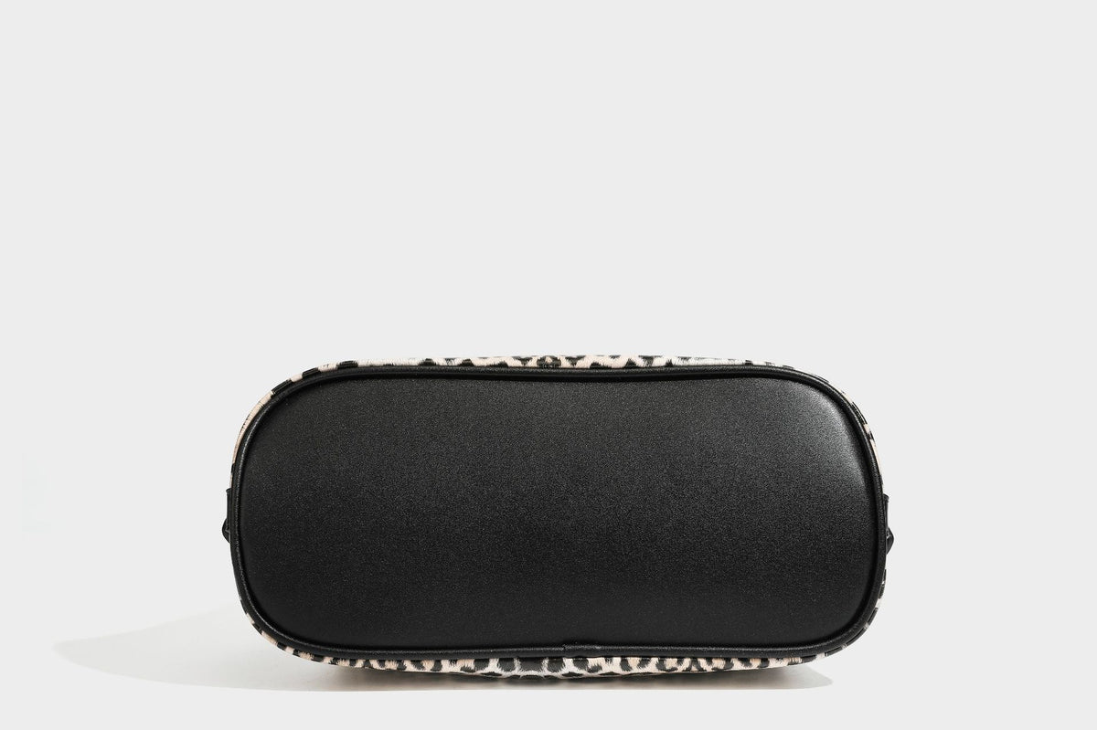 Slouchy leopard print shoulder hobo bag with black leather-look trim, tie-top closure, and single long strap, detail view 35