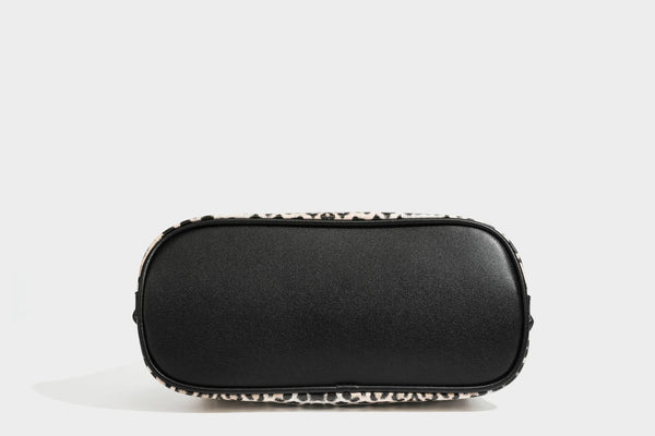 Slouchy leopard print shoulder hobo bag with black leather-look trim, tie-top closure, and single long strap, detail view 35