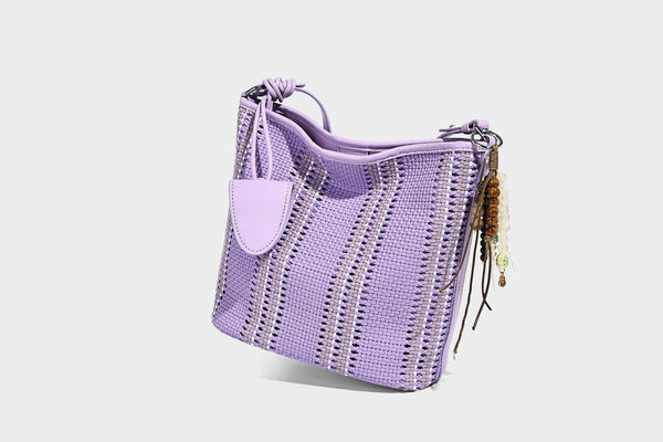 Woven bucket shoulder bag with leather-look trim, silver-tone hardware, and beaded tassel charm, detail view 43