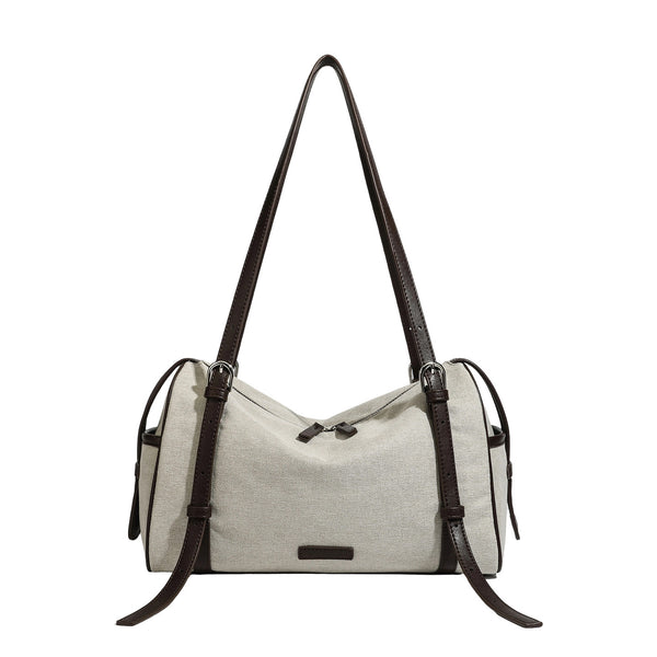 Cream canvas barrel shoulder bag with dark brown leather-look straps, trim, and silver-tone hardware, detail view 5