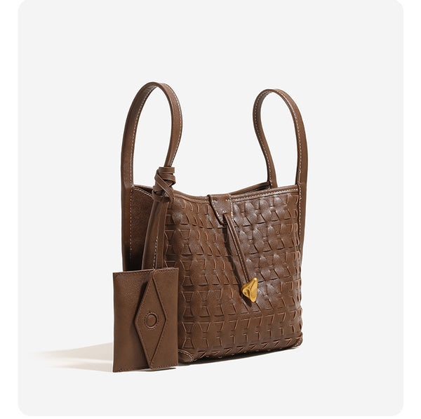 Woven embossed leather-look bucket bag with triangular texture pattern, gold-tone hardware, and attached mini snap pouch