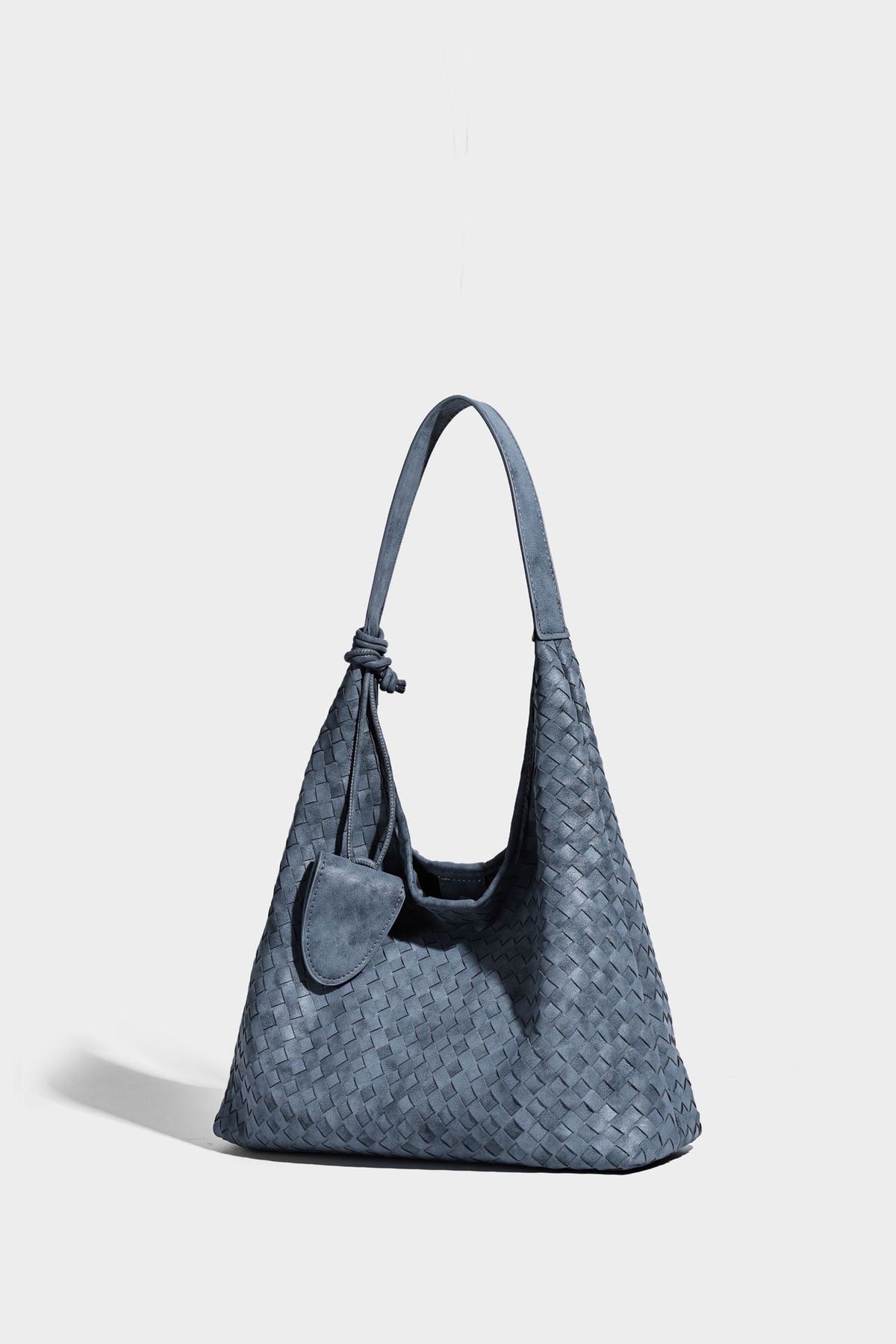 Slouchy woven hobo shoulder bag with knotted strap and matte leather-look textured finish, detail view 16