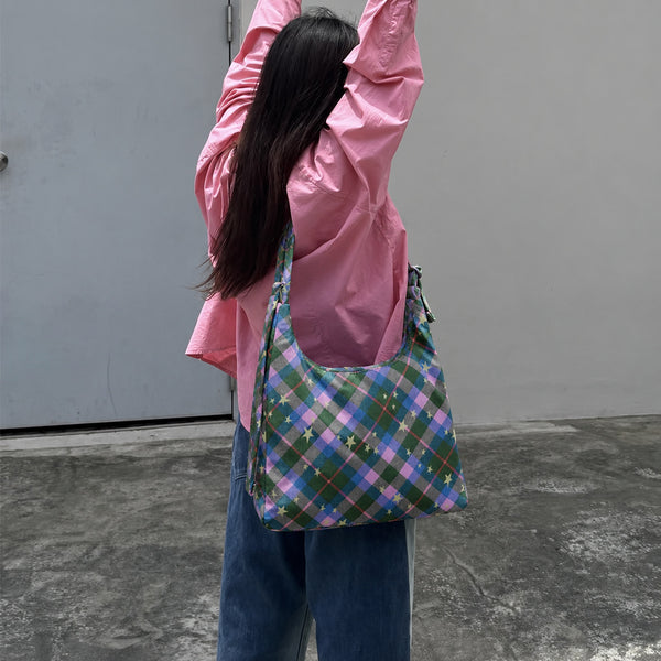 Multicolor plaid and star print hobo shoulder bag with knotted strap and silver-tone zip closure, detail view 13