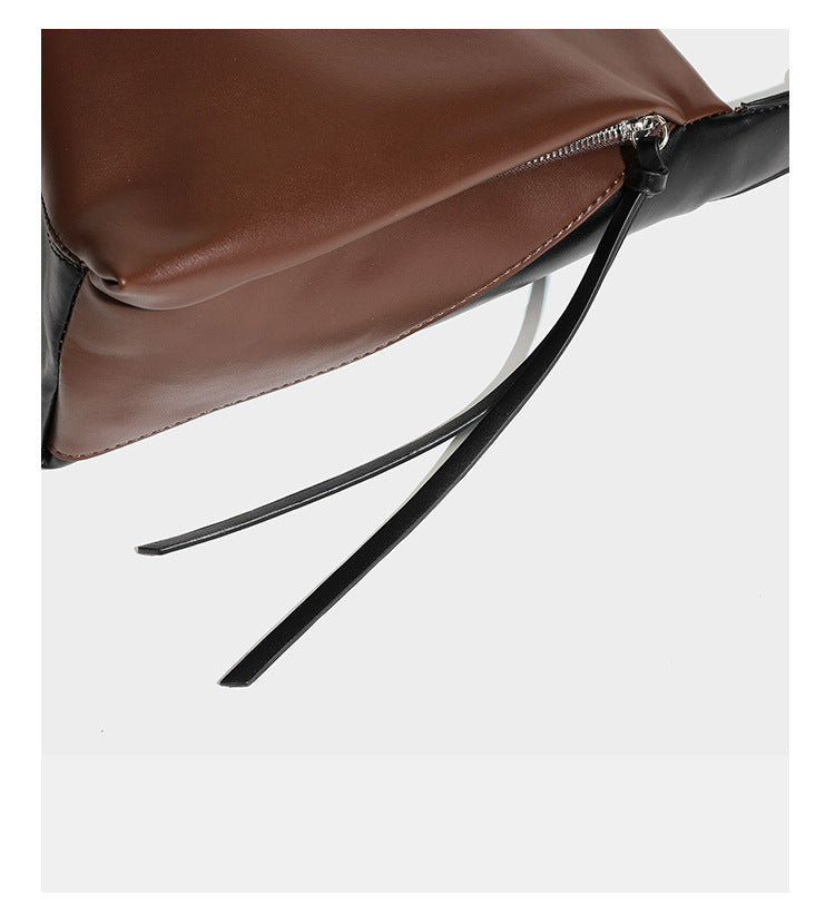 Two-tone black and brown leather-look slouchy shoulder bag with beaded tassel charm and silver-tone hardware, detail view 17
