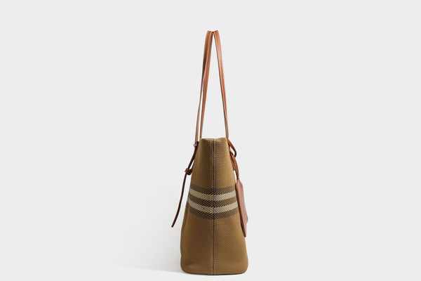 Large structured plaid check tote bag with smooth tan leather-look shoulder straps, attached front zip pouch, and gold-tone
