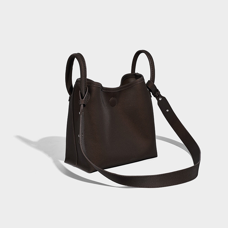 Small structured matte pebbled tote bag with twin top handles and removable zip pouch, front view