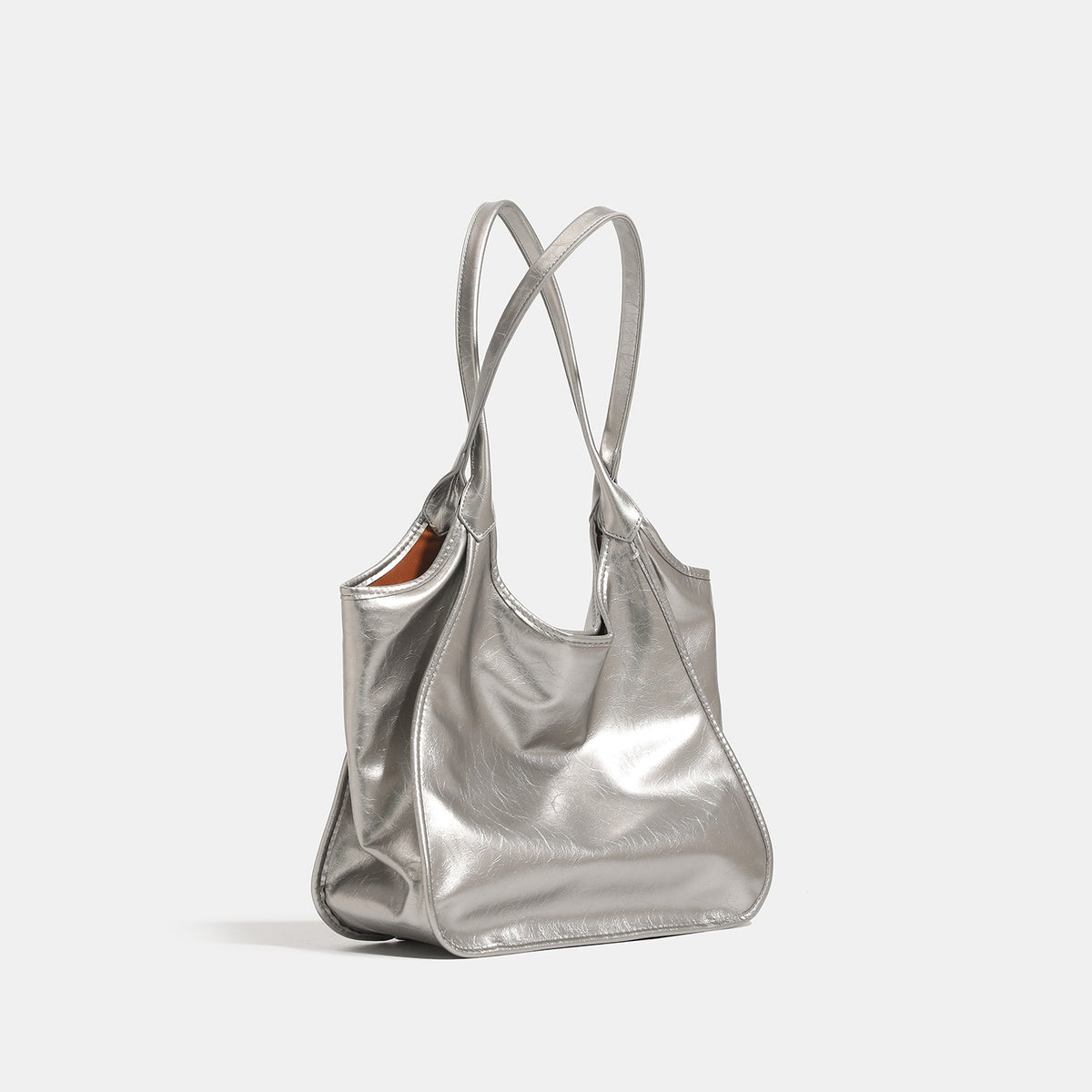 Large open-top shoulder tote bag with glossy crinkled metallic finish and long double straps, detail view 3