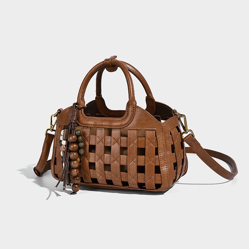 Small structured woven lattice top-handle satchel bag with bead-and-tassel charm and gold-tone hardware, detail view 8