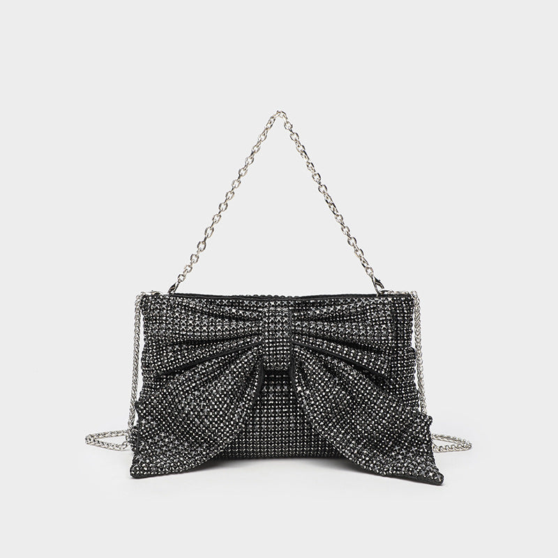 Kleine rechteckige Clutch zum Umhängen mit Schleife, vollständig mit Strasssteinen besetzt, silberfarbenem Kettenriemen, Detailansicht 8