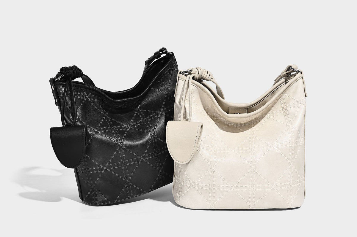 Diamond-quilted leather-look bucket shoulder bag with knotted strap accent and attached mini pouch, detail view 16