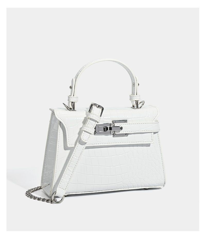 Croc-embossed mini top-handle satchel with silver turn-lock closure and adjustable crossbody strap, detail view 20