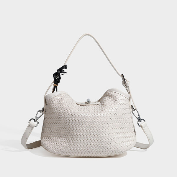 Small woven-look leather-look flap shoulder hobo bag in burgundy with silver-tone hardware and decorative tassel charm
