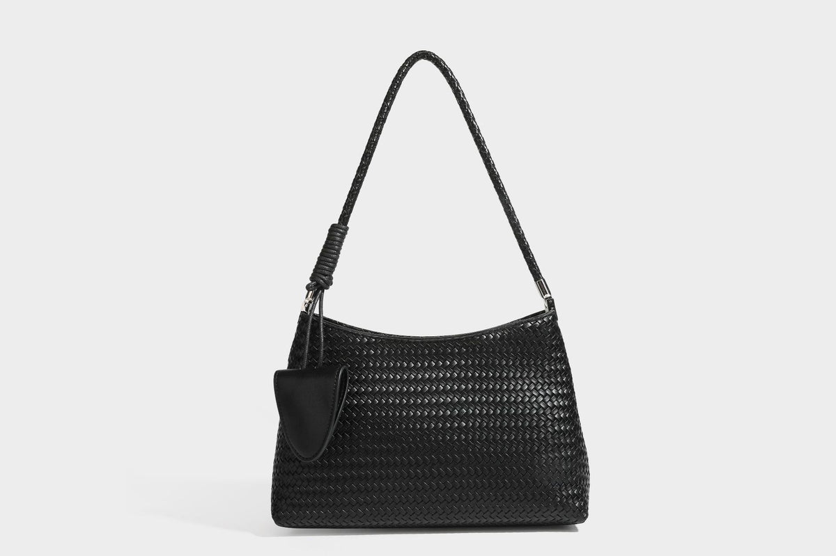 Woven-texture hobo shoulder bag in brown with braided top handle, adjustable crossbody strap, front flap pocket, and, detail