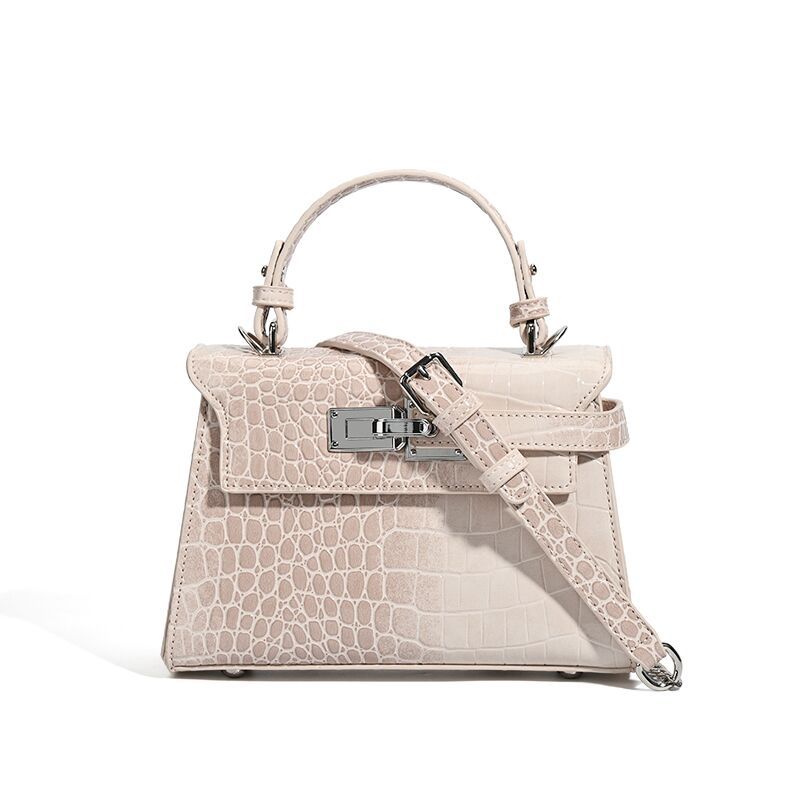 Croc-embossed mini top-handle satchel with silver turn-lock closure and adjustable crossbody strap, detail view 5