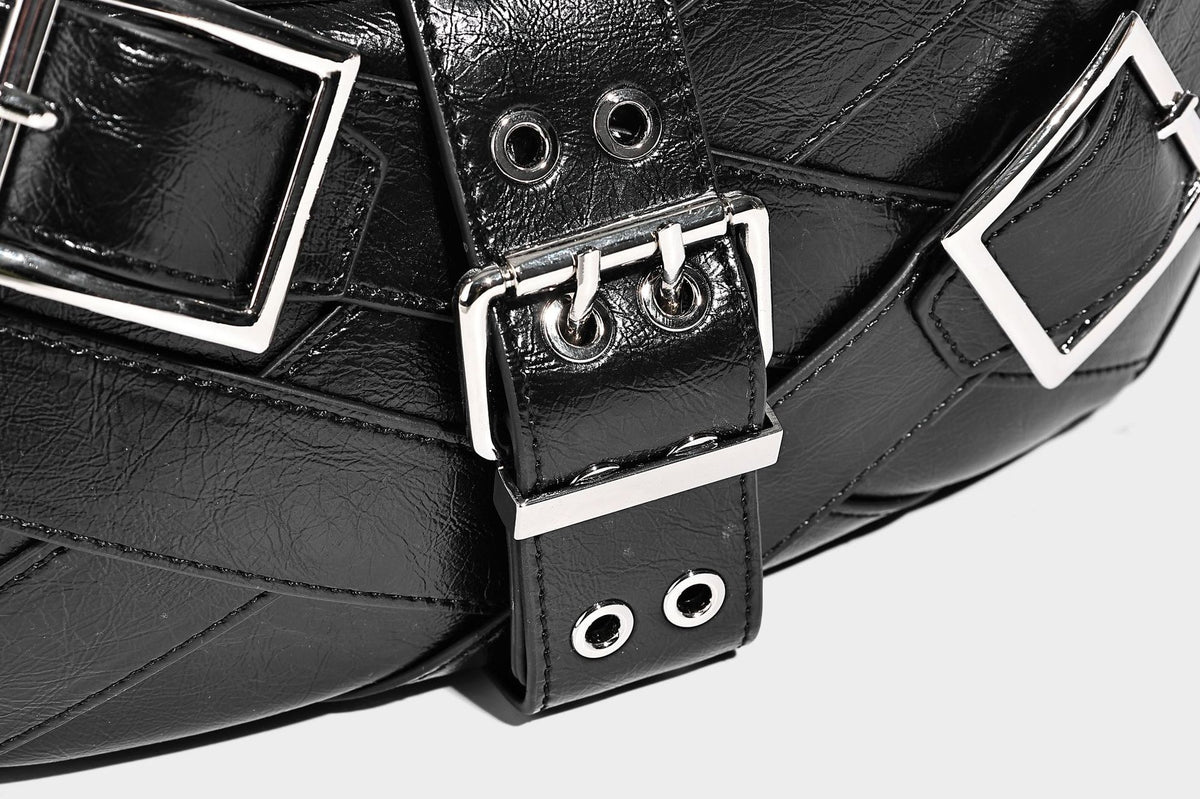 Glossy crescent hobo bag with silver-tone grommets, square buckle straps, and top zipper closure, detail view 20